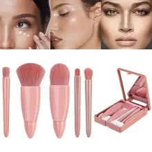 Five mini makeup brushes with rose-beige handles plus an open compact case