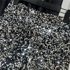 Black sequined shorts with dense silver sequins and high-shine front surface