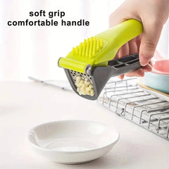 1 garlic press, a tool for crushing and squeezing garlic, a small household outdoor kitchen tool