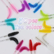 Assorted color disposable eyelash mascara wands with comb-like bristles and clear stems