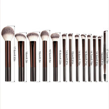 Makeup brush set with long brown handles and white-and-gray bristles, numbered lineup