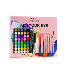 Eyeshadow makeup gift set in pink box with palette, brushes, eyeliner and mascara tubes.