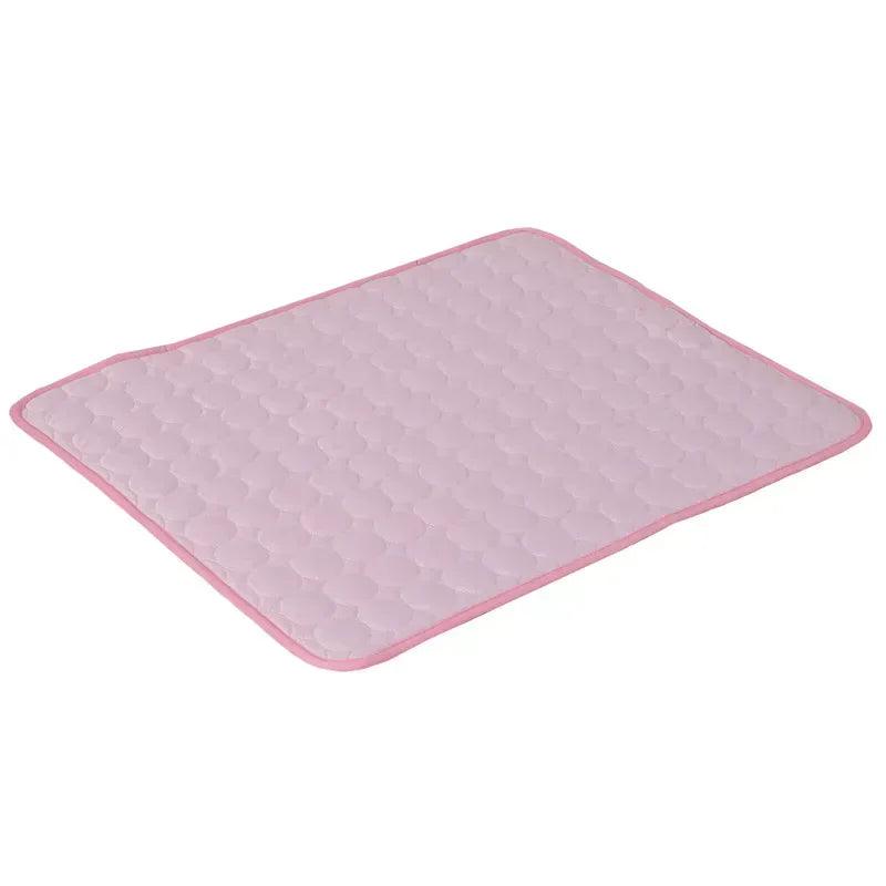Light pink cooling mat with raised textured honeycomb pattern and rounded corners.