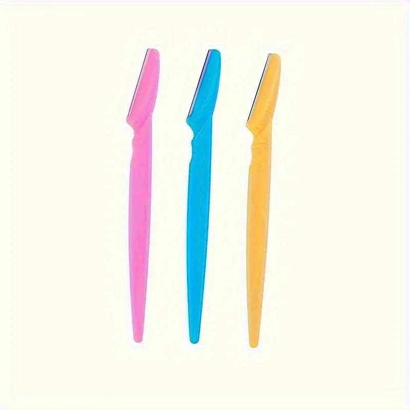 Three-color hair trimmer razors in pink, blue and orange