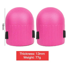 Pair of pink knee pads with black side straps, rounded dome shape.