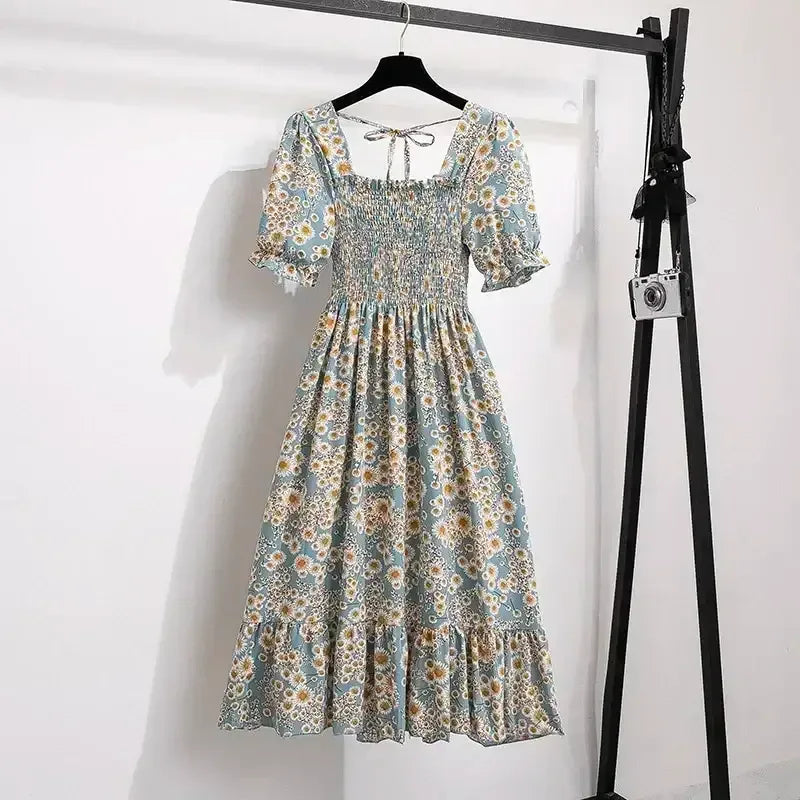 Floral A-line dress with smocked bodice, short puff sleeves, and elastic waist