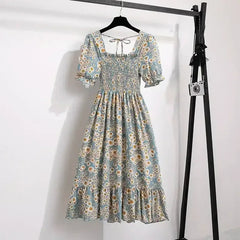 Floral A-line dress with smocked bodice, short puff sleeves, and elastic waist