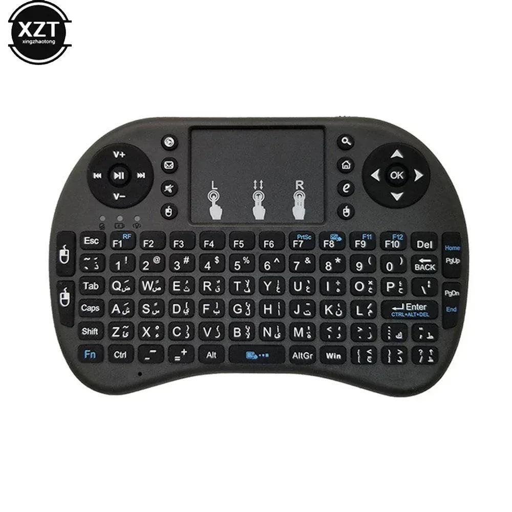 Mini wireless keyboard with touchpad, black body, green and cyan backlit keys