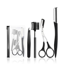 Eyebrow grooming tools set with scissors, razor blades, comb, and small accessories