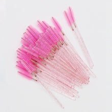 Disposable eyelash brush comb wands with pink bristles and crystal clear handles