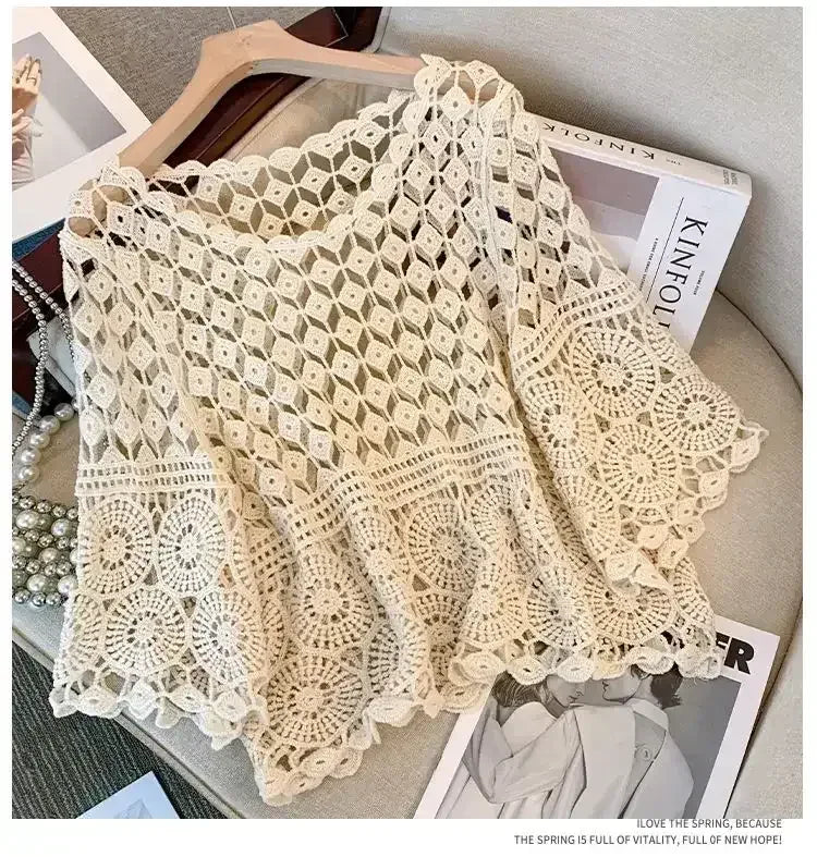 Off-white crochet lace top with wide half sleeves and circular lace motifs