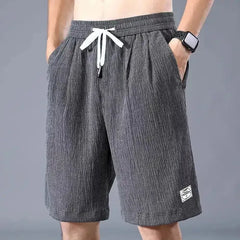 Men's gray drawstring silk shorts with elastic waistband and knee-length relaxed fit