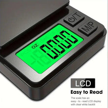 Close-up of mini digital scale’s green backlit LCD on a dark body