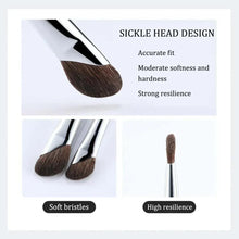 Makeup brush head with dense brown bristles on a silver ferrule, black handle