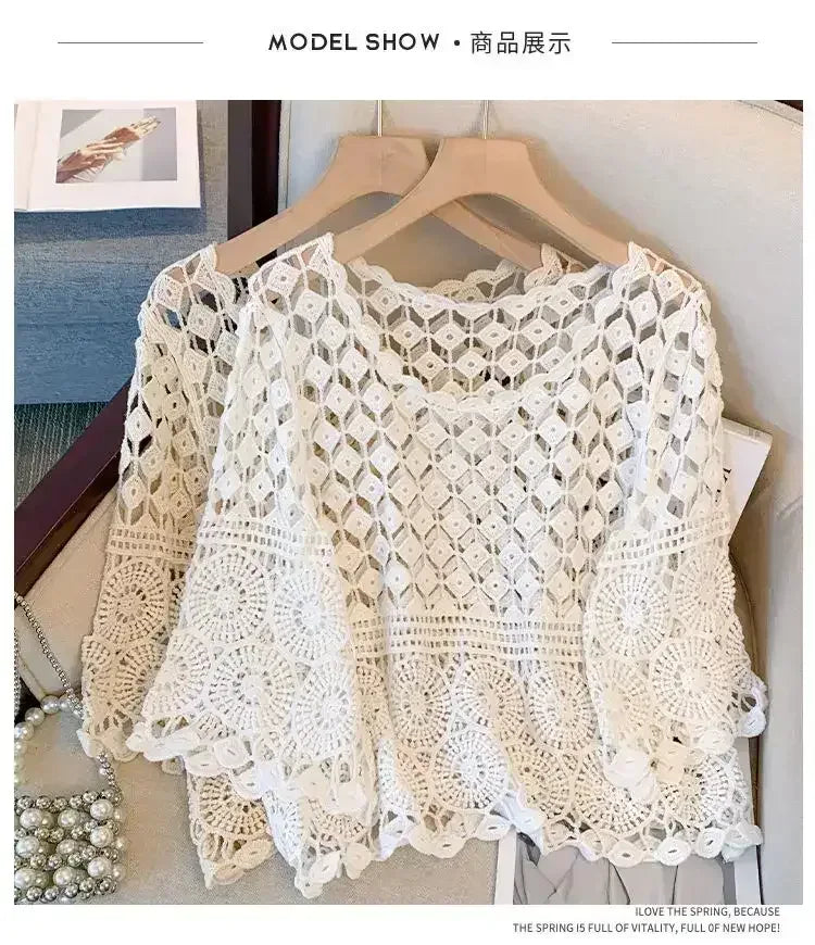 White crochet lace tunic top with wide half sleeves, round neckline, open geometric pattern