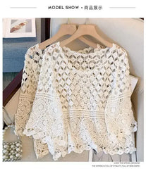 White crochet lace tunic top with wide half sleeves, round neckline, open geometric pattern