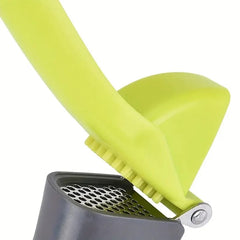 1 garlic press, a tool for crushing and squeezing garlic, a small household outdoor kitchen tool
