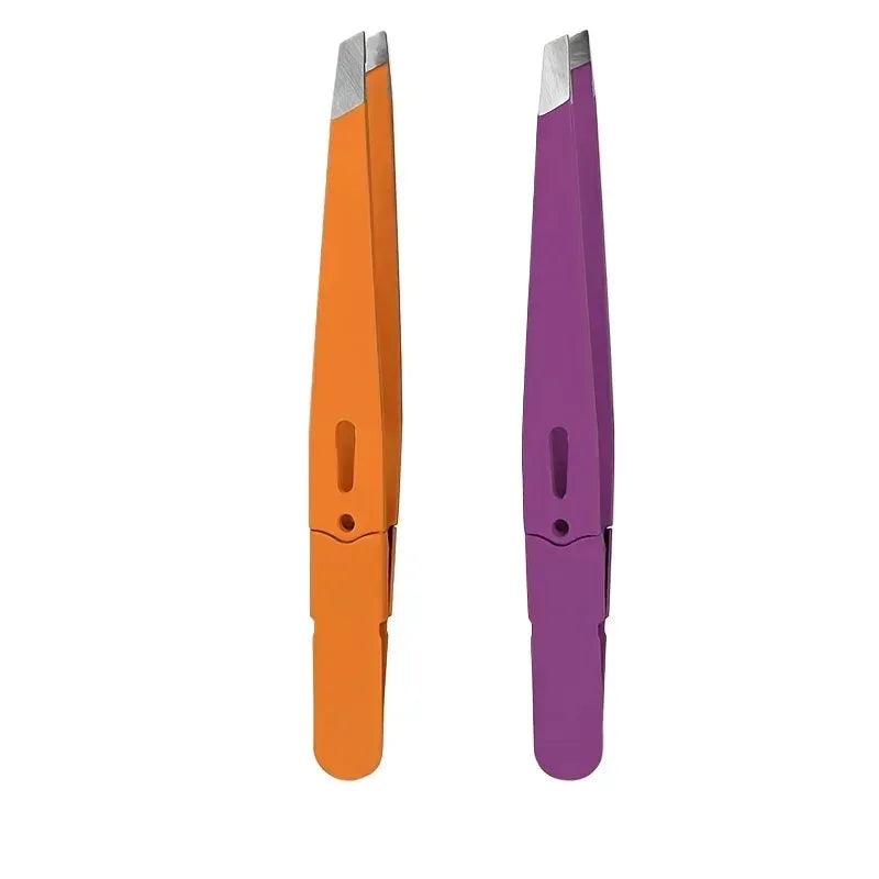 Orange and purple slanted eyebrow tweezers with fine pointed tips, stainless steel