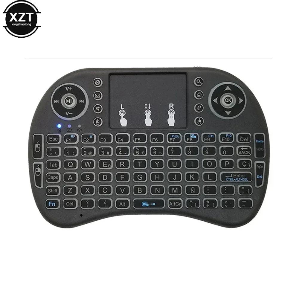 Mini wireless keyboard with faint blue backlit keys and touchpad, front view