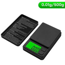 Digital pocket scale with green backlit LCD displaying 0.000 and protective cover