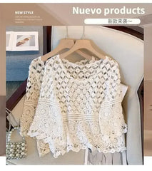 White crochet lace half-sleeve top with openwork pattern on hanger