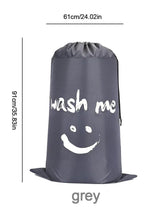 Grey nylon drawstring laundry bag with 'wash me' smiley face graphic