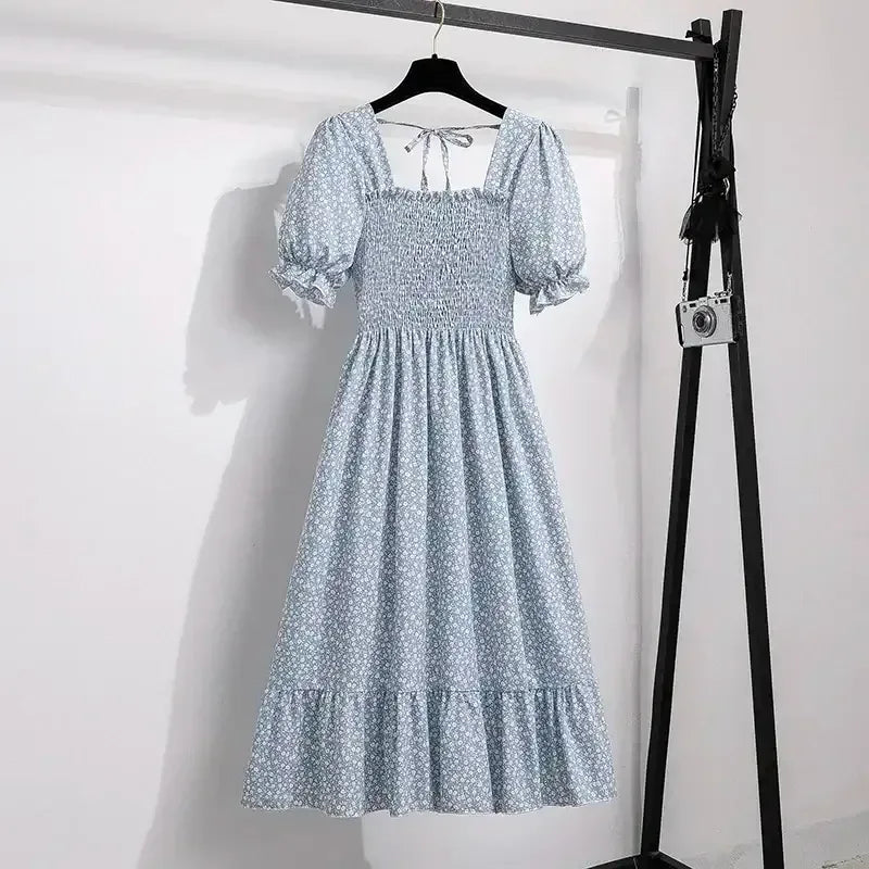 Light blue patterned chiffon A-line dress with puff sleeves, elastic waist, tiered hem