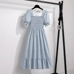 Light blue patterned chiffon A-line dress with puff sleeves, elastic waist, tiered hem