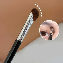 Angled contour nose makeup brush with brown bristles, silver ferrule, and black handle