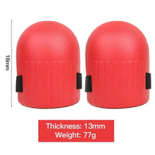 Pair of red knee pads with black straps and curved protective caps