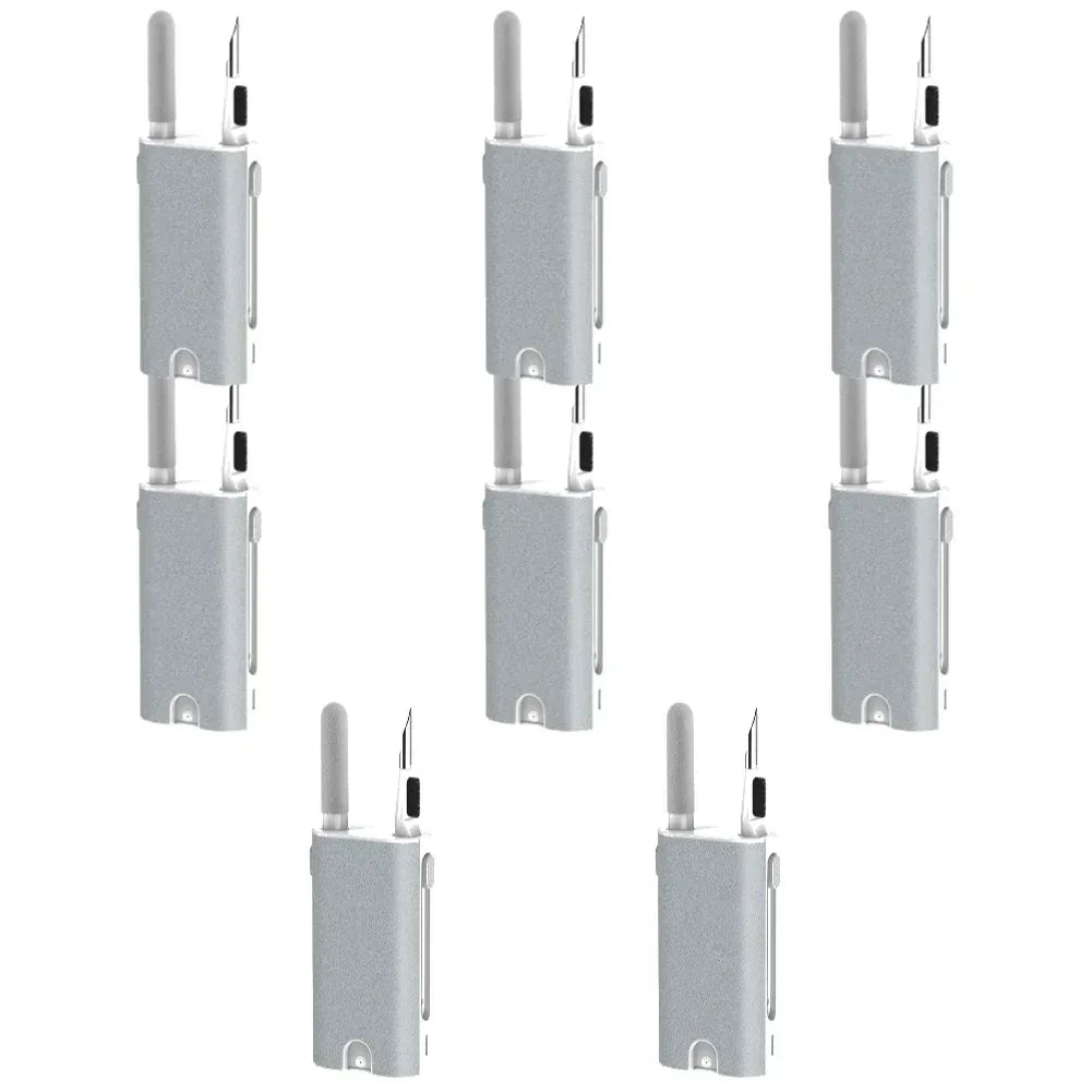 Earphone cleaner brush kit with several gray units stacked, each with bristle brush and pen tool