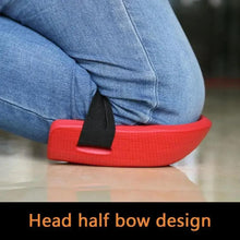 Red knee protection pad with black strap, half-bow design on jeans.