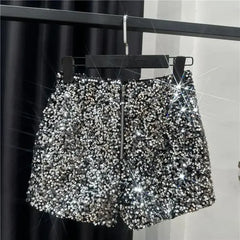 Silver sequined shorts with front zip and all-over metallic sparkle