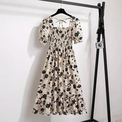 Cream and black floral chiffon A-line dress with puff sleeves, elastic waist, tiers