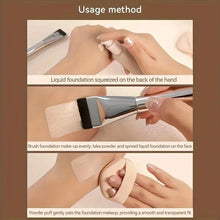 Foundation brush with silver handle and black bristles, held for applying liquid makeup