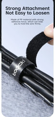 Black cable organizer wire tie loops securing bundled cables