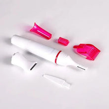 Hair removal trimmer kit with white handle and pink attachment heads