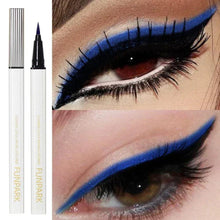 Blue liquid eyeliner pens with thick blue winged eyeliner on an eye