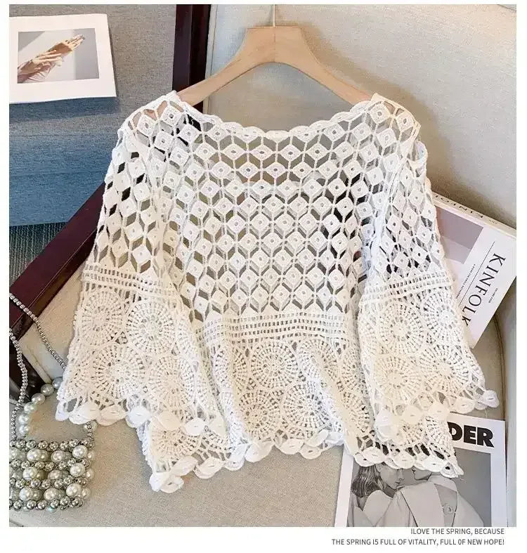 White crochet lace top with diamond openwork panel and circular lace motifs on sleeves