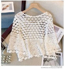 White crochet lace top with diamond openwork panel and circular lace motifs on sleeves