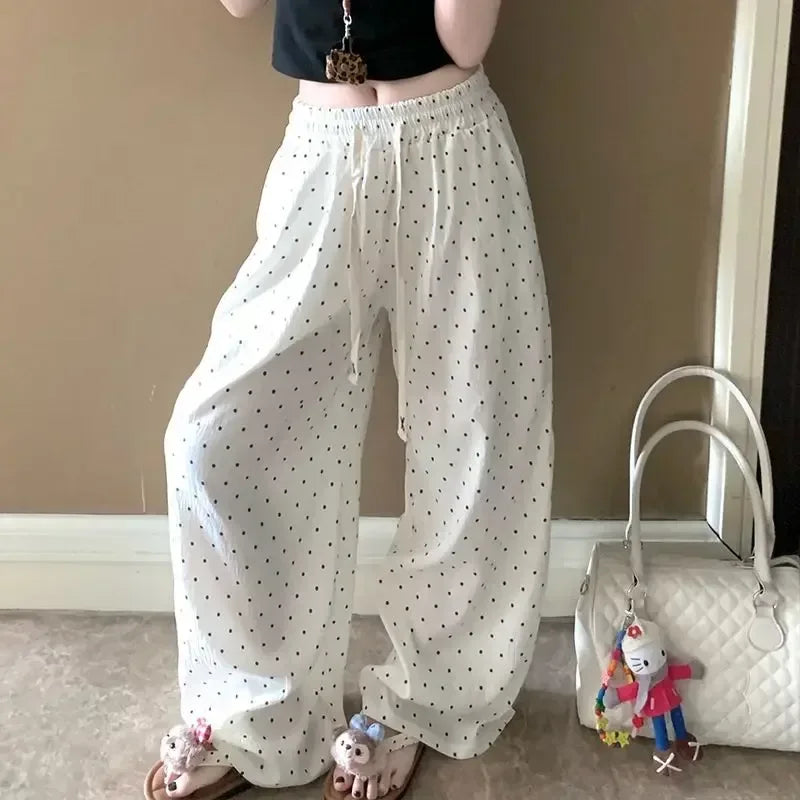 Women's polka dot wide-leg trousers with elastic high waist, white with dark dots