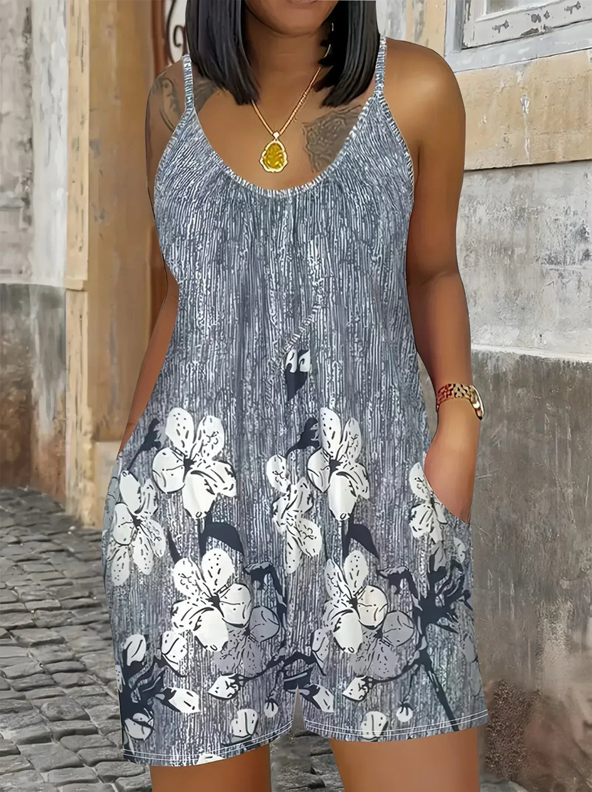 Sleeveless gray romper with small bunny print and matching shorts, scoop neckline
