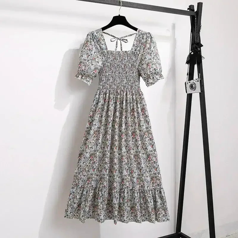 Ditsy floral A-line dress with smocked bodice, short puff sleeves, and elastic waist