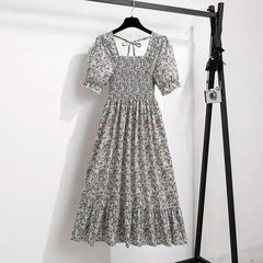 Ditsy floral A-line dress with smocked bodice, short puff sleeves, and elastic waist