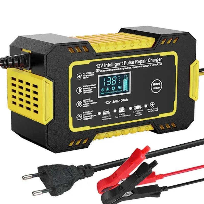 Car battery charger with LCD display, yellow/black housing and red cable clips