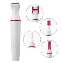 Hair trimmer with black grooming head and three inset blade heads, white and pink