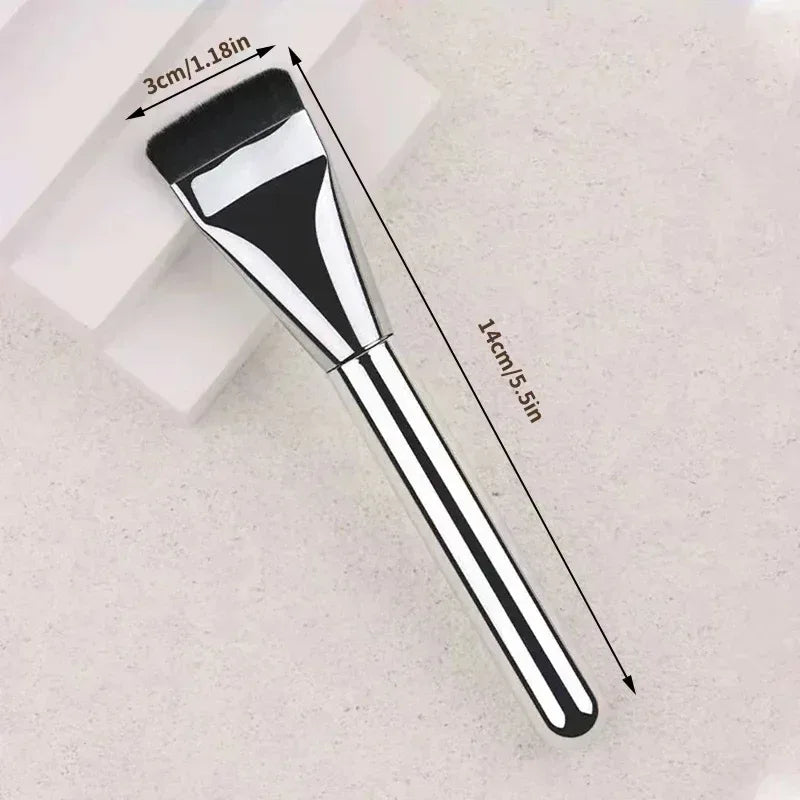 Flat makeup brush with black bristles and silver ferrule, black handle
