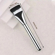 Flat makeup brush with black bristles and silver ferrule, black handle