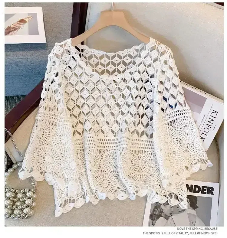 White openwork crochet lace top with scalloped hem and wide half sleeves