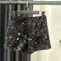 Silver sequin velvet shorts on hanger, front view with elastic waistband